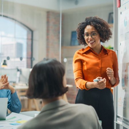 young woman leading meeting